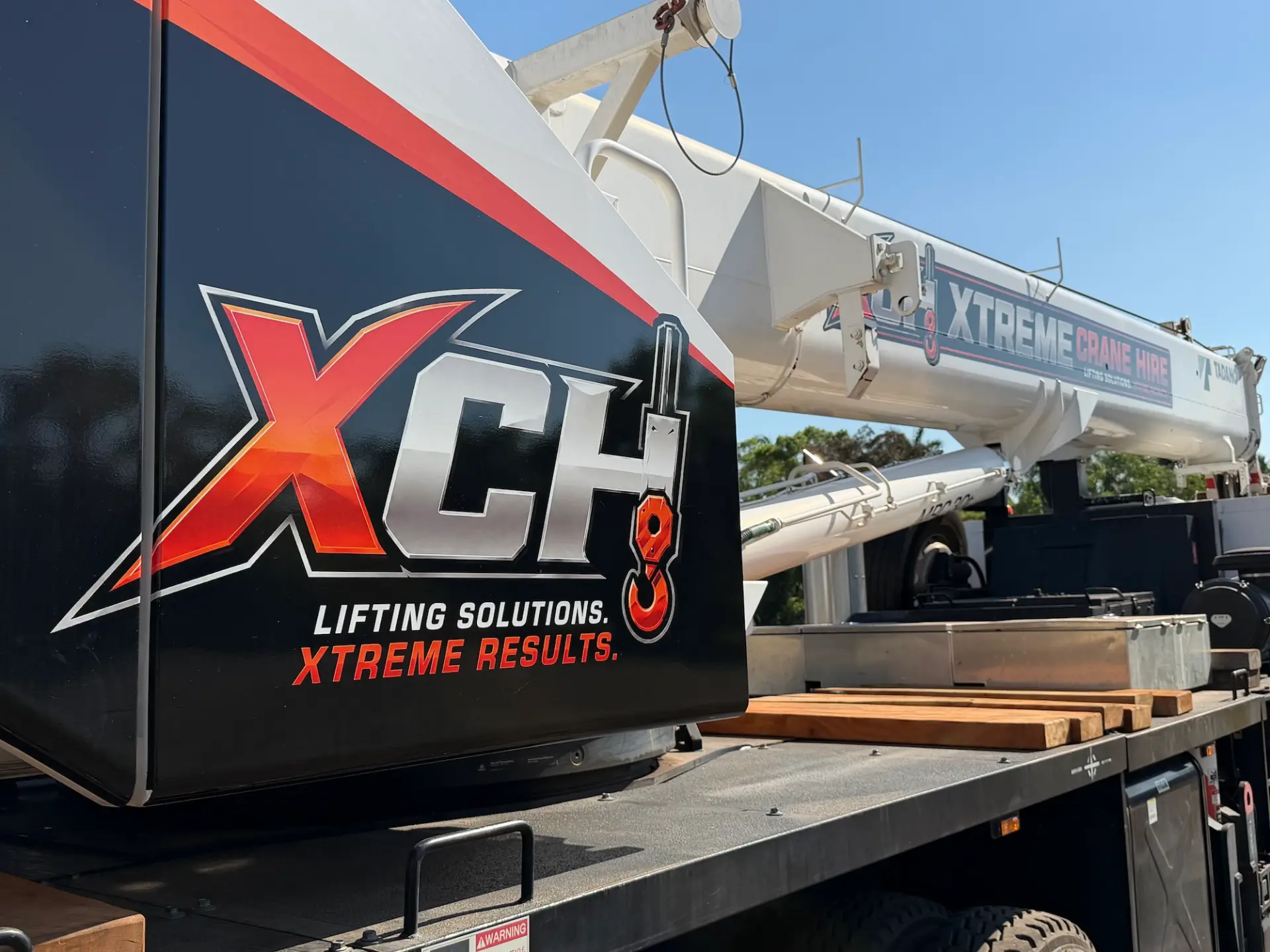 XCH branded Tadano GT-300EL truck-mounted crane side view